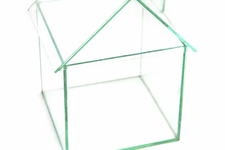 Clear Image of House or Building with frame lines only. Clear glass house model with a simple roof structure.