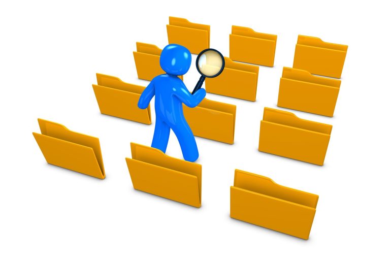 Blue Character searching files to insure quality and attention to detail. Blue figure holding a magnifying glass among yellow file folders.